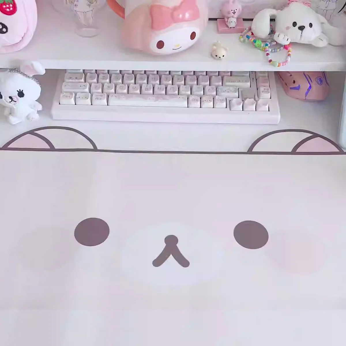 Close-up of Rilakkuma desk mat designs