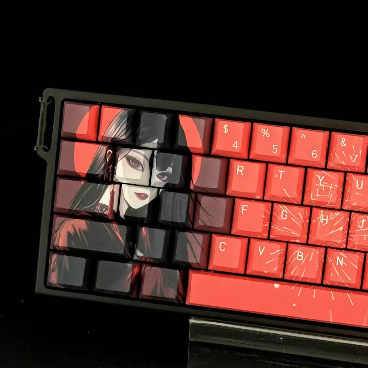 Close-up of a keycap featuring intricate Snake Woman character art details
