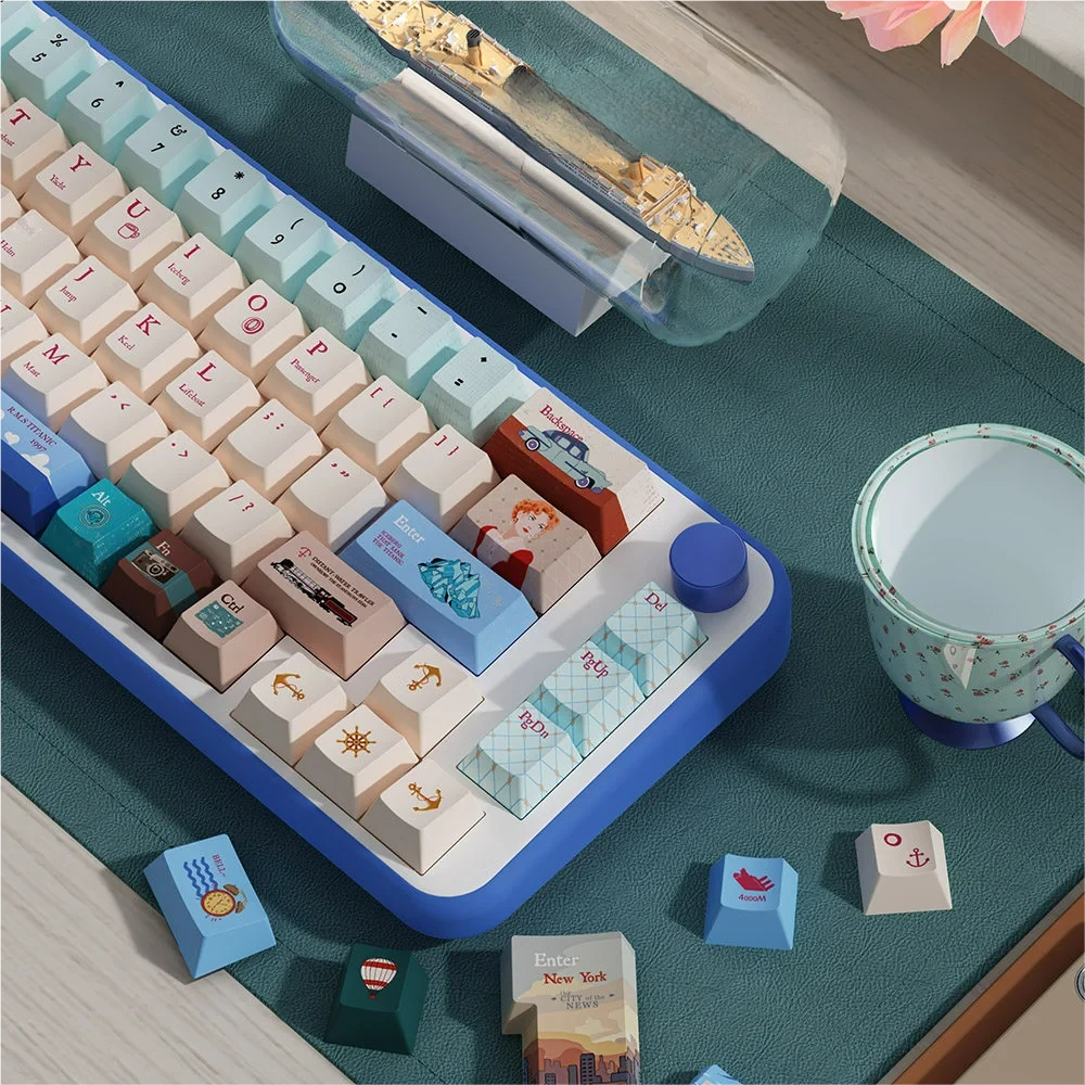 Close-up of Titanic-themed novelty keycaps, including ship and iceberg designs, with dye-sublimated legends.