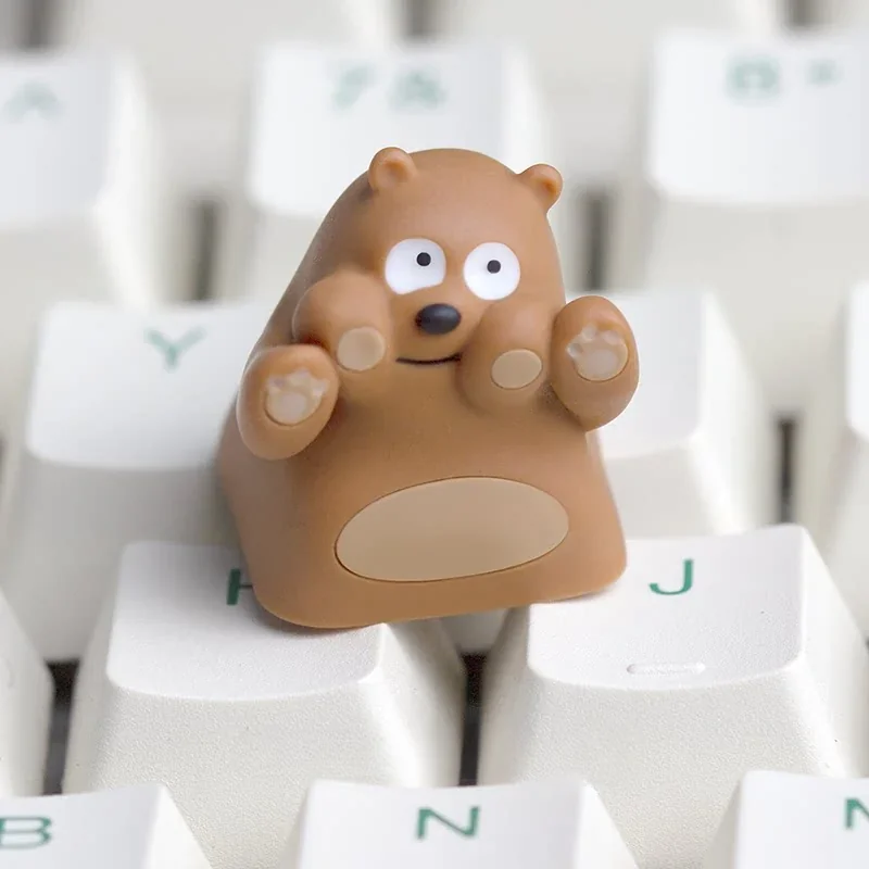 Three We Bare Bears keycaps (Grizzly, Panda, Ice Bear) on a keyboard setup