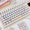 Dreamy pastel pink and purple keycaps with unique novelty designs for mechanical keyboards