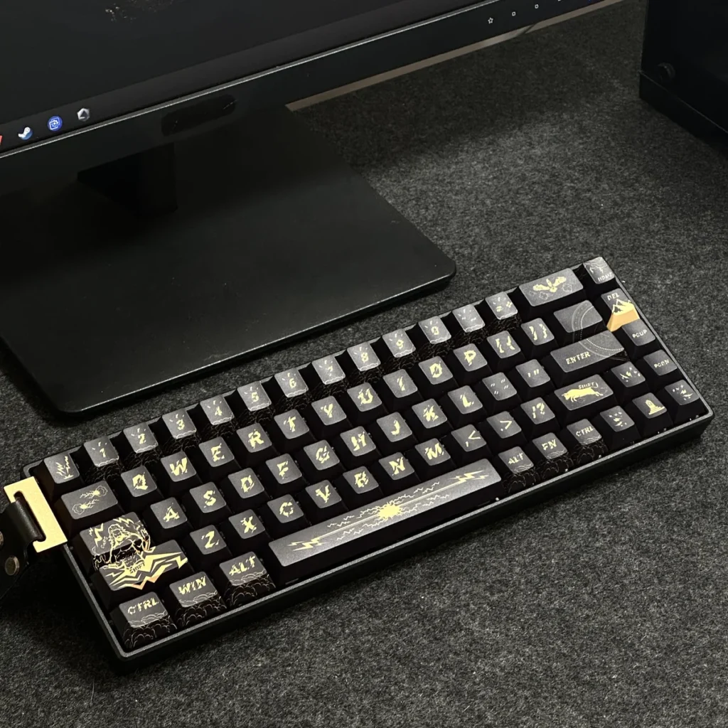Full view of the Zeus PBT Keycap Set on a mechanical keyboard, showcasing the black and gold mythological theme.