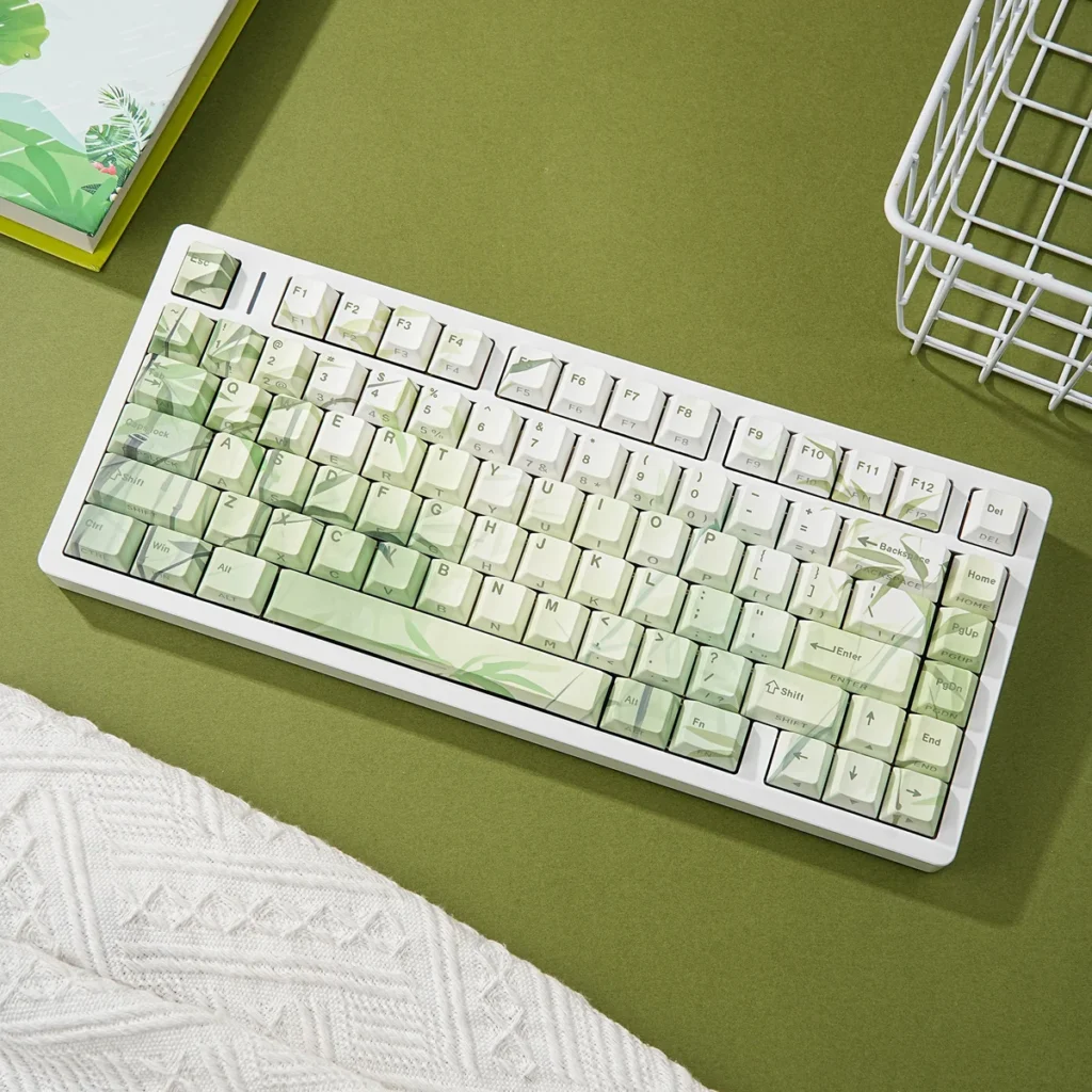 Bamboo Forest PBT Keycap Set on a minimalist keyboard, showcasing green bamboo motifs