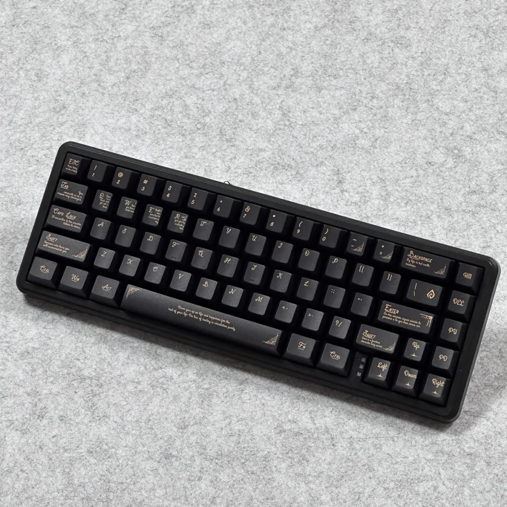Black Gold Baroque keycap set mounted on a sleek black mechanical keyboard, demonstrating aesthetic harmony.