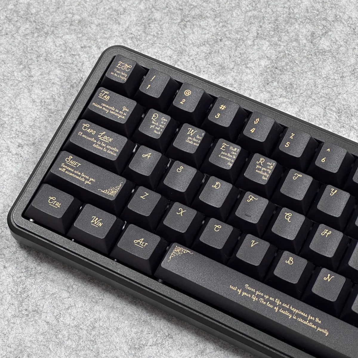 Close-up detail of the intricate black and gold Baroque pattern on a PBT keycap, highlighting dye-sublimation quality.