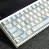 Close-up of Blue Melody dye-sub PBT keycaps, highlighting the smooth texture and crisp legends.
