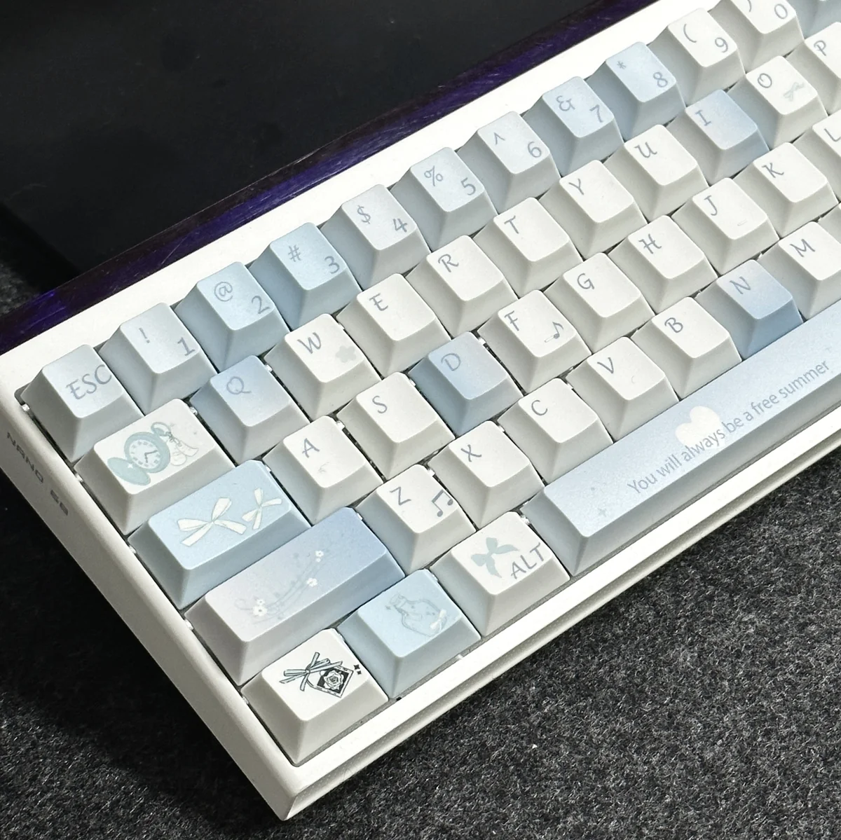 Close-up of Blue Melody dye-sub PBT keycaps, highlighting the smooth texture and crisp legends.