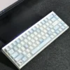 Hands typing on a keyboard fitted with Blue Melody Cherry profile keycaps, illustrating ergonomic comfort.