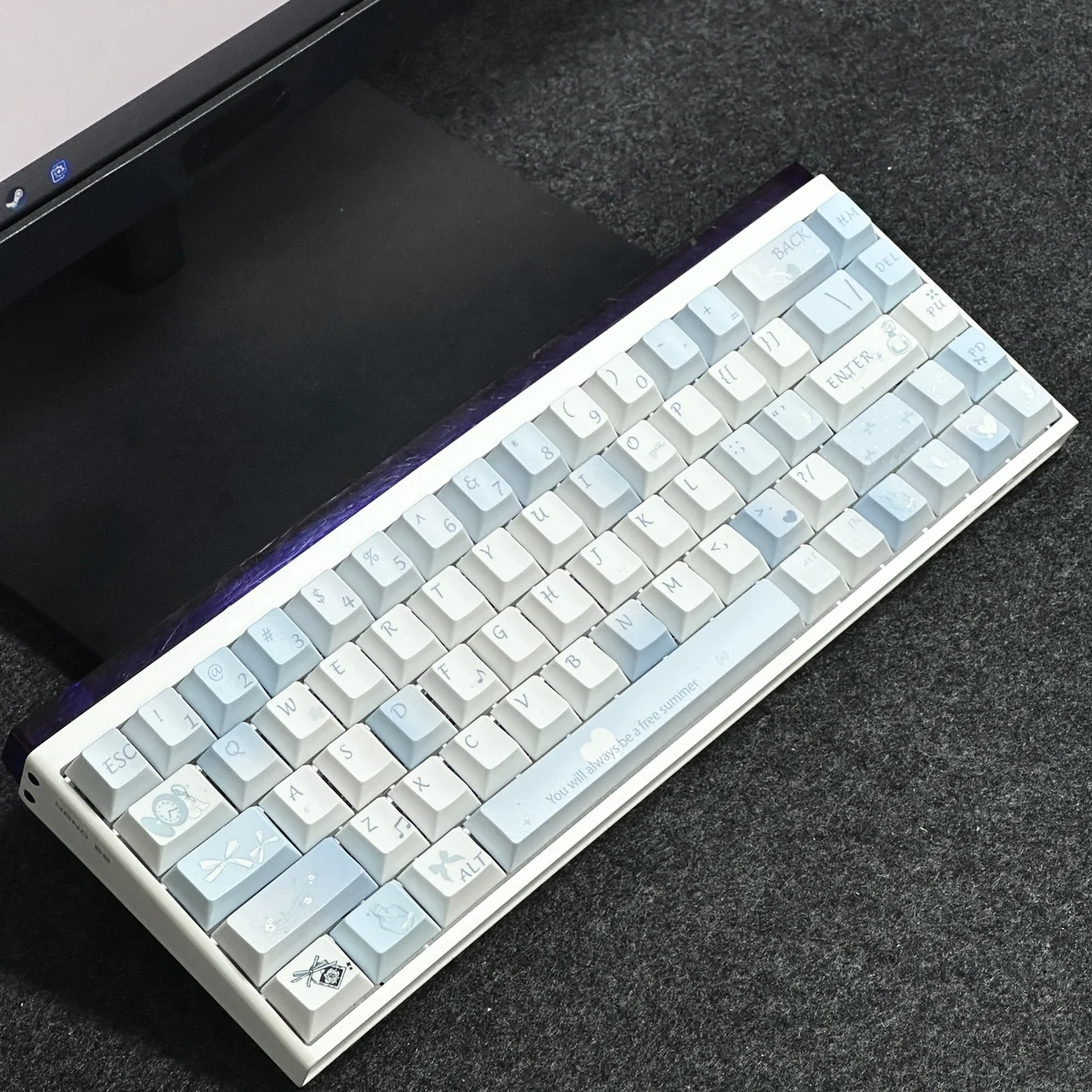 Hands typing on a keyboard fitted with Blue Melody Cherry profile keycaps, illustrating ergonomic comfort.