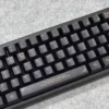 Side profile view of the Black Gold Baroque keycaps, showcasing the ergonomic Cherry profile.