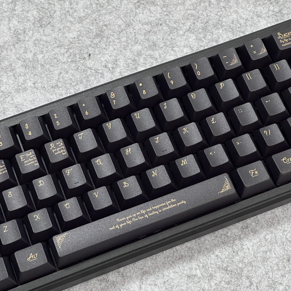 Side profile view of the Black Gold Baroque keycaps, showcasing the ergonomic Cherry profile.