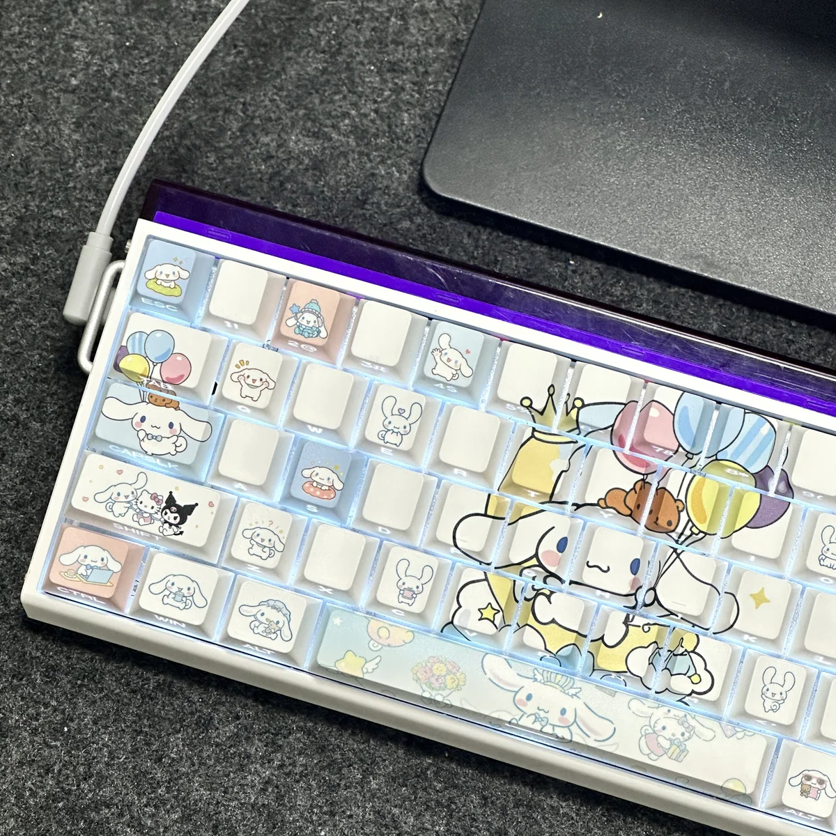 Close-up of Cinnamoroll keycap with side-lit legends