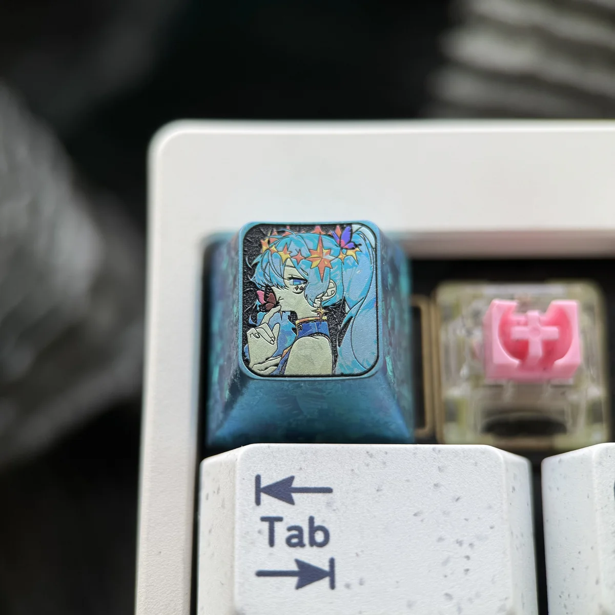 Close-up of Hatsune Miku titanium keycap detailing