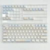 Lifestyle image of Cloud Floral keycaps enhancing a minimalist desk setup