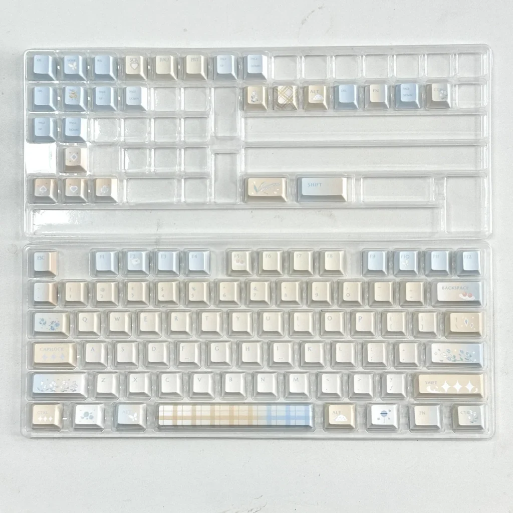 Lifestyle image of Cloud Floral keycaps enhancing a minimalist desk setup
