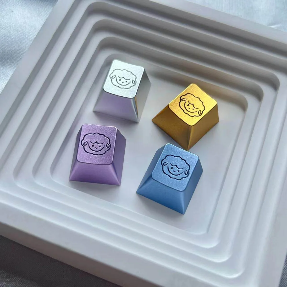 Four Cute Sheep Keycaps (Gold, Silver, Purple, Blue) Side by Side
