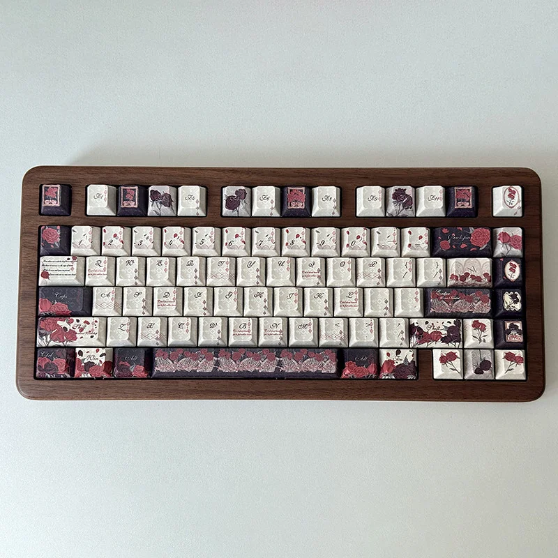 Close-up of Dark Rose PBT Dye-sub Keycap Set with intricate red and black floral design