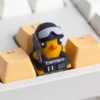 Gaming keyboard with the Escape from Duckov tactical duck ESC keycap installed, highlighting its unique placement and design.