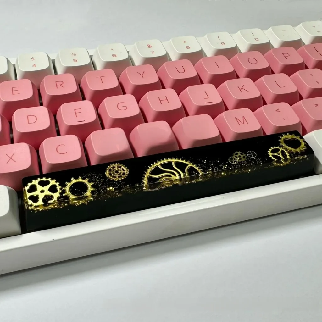 Close-up of the Gear Spacebar Keycap showcasing transparent resin and detailed internal gears.