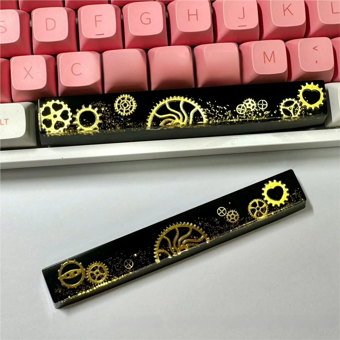 Handcrafted resin Gear Spacebar Keycap with intricate industrial gears encased, on a mechanical keyboard.