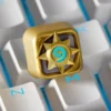 Close-up of golden Hearthstone emblem on resin keycap