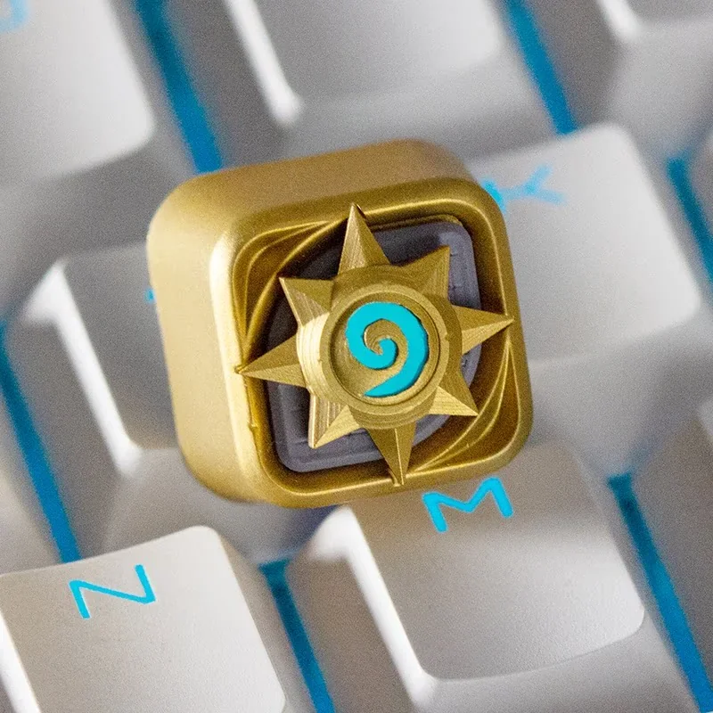 Close-up of golden Hearthstone emblem on resin keycap