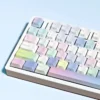 Close-up of iridescent PBT keycaps with ethereal bubble design