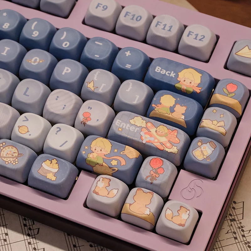 Layout compatibility example of the 132-key Le Petit Prince set, showing different keyboard sizes and keys included.
