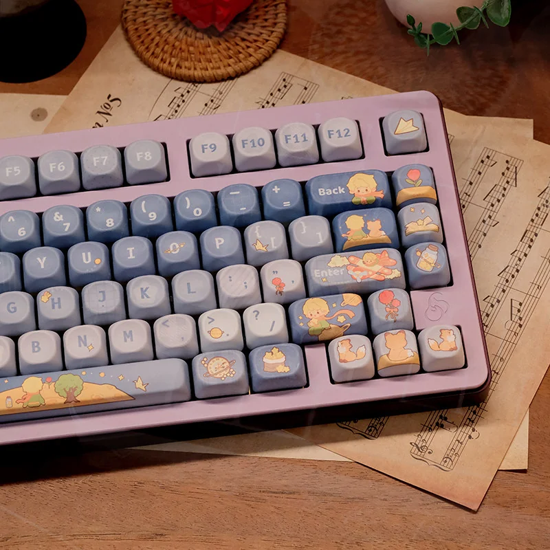 Angled view of the Little Prince keycap set, featuring character art and the unique, comfortable MOA keycap sculpt.