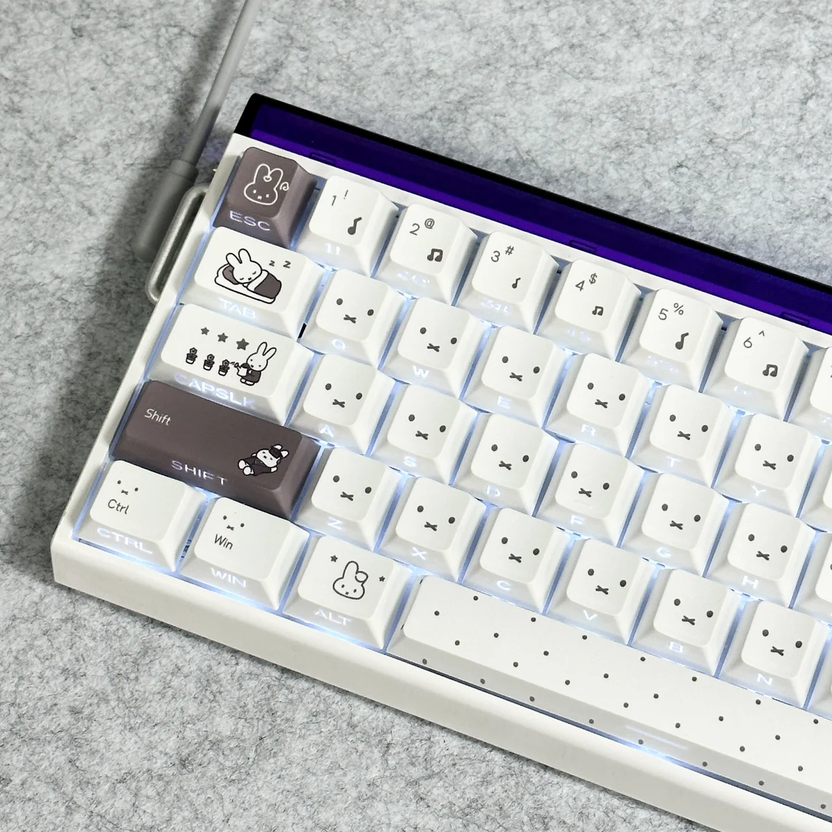 Close-up of a Miffy character keycap from the PBT set, highlighting intricate side-print detail