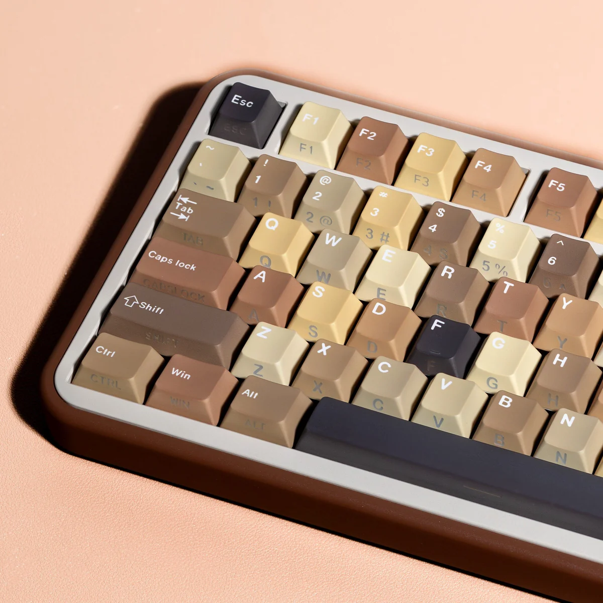Close-up of Milk Coffee keycaps, highlighting the dye-sublimated legends and PBT texture.