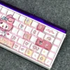 Detailed view of My Melody keycaps illuminated by keyboard backlight, highlighting the unique side legends