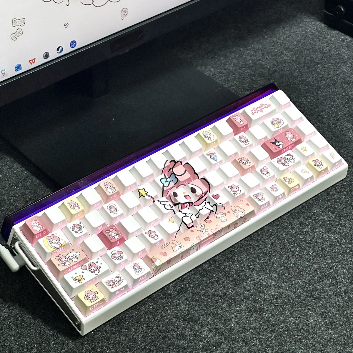 Angle shot of My Melody themed keycaps showcasing the pastel pink and white aesthetic