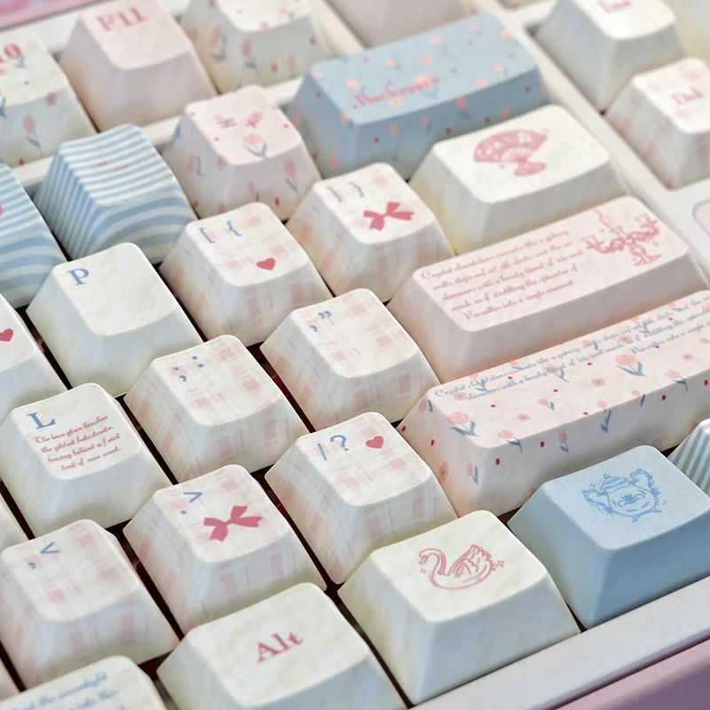 Full layout of Rococo-themed pastel keycaps, top view