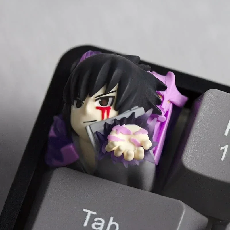 Sasuke Uchiha backlit resin keycap glowing on a mechanical keyboard