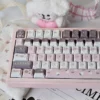 Side view of Strawberry Rabbit keycaps, demonstrating their ergonomic Cherry profile
