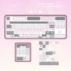Lifestyle image of the Strawberry Rabbit keycap set on a desk with complementary cute and whimsical accessories