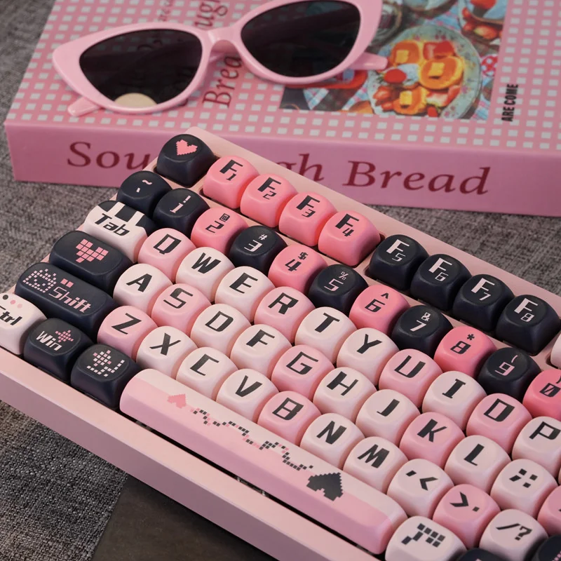 Close-up of Sweetheart Black Pink MOA profile keycaps, showing dye-sub legends