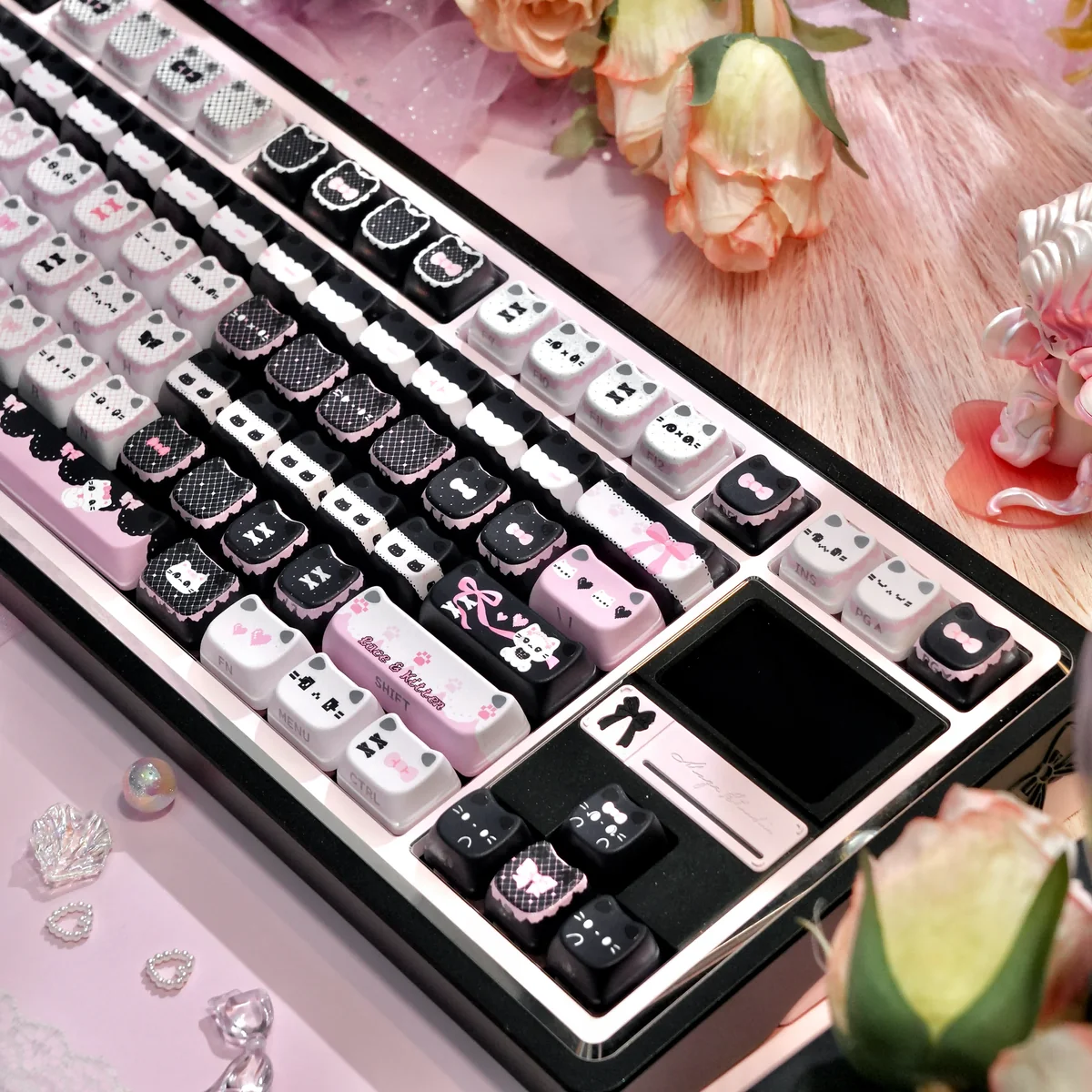 Lace Cat themed keycaps arranged on a desk, emphasizing whimsical artistry