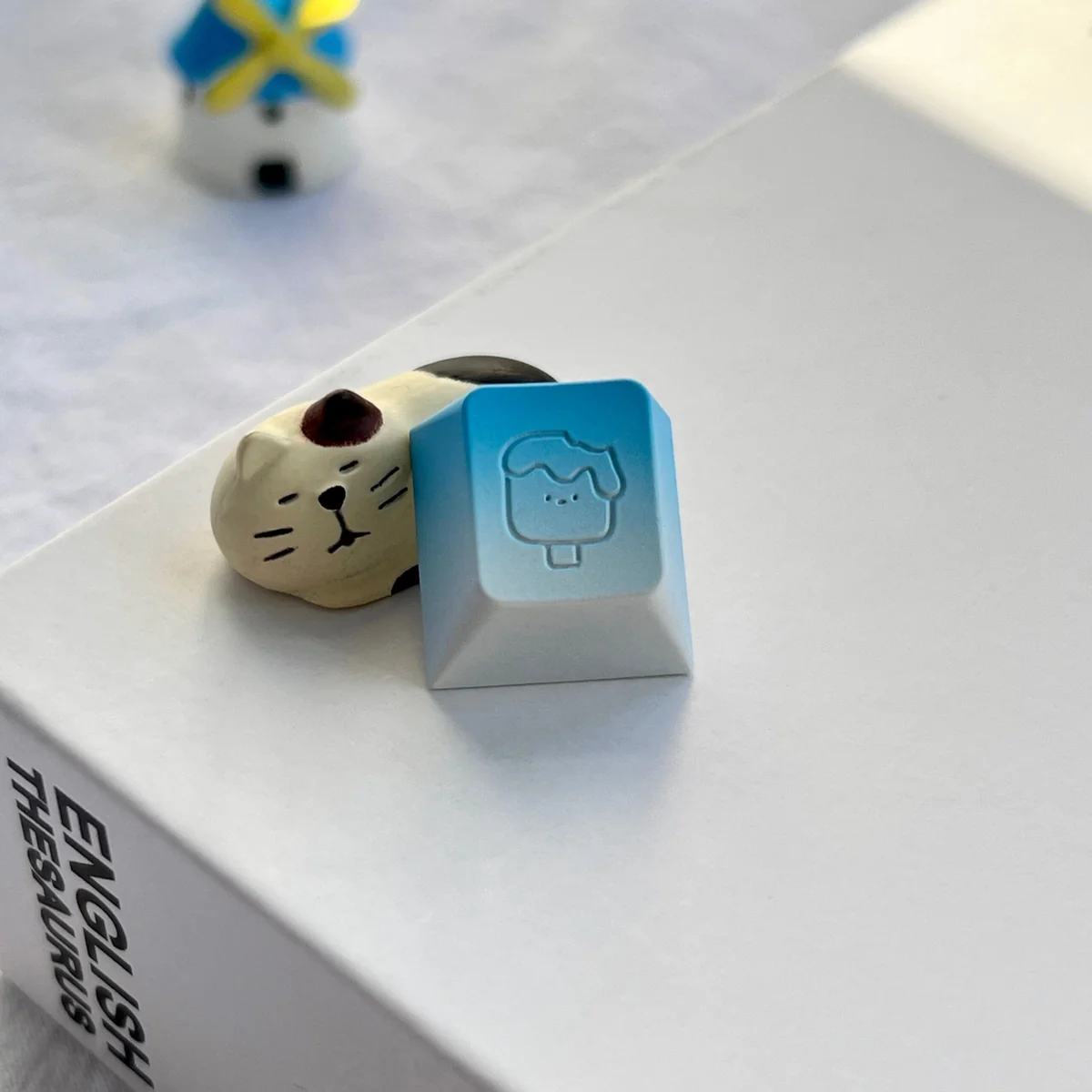 Close-up of aluminum artisan keycap showcasing intricate ice cream texture