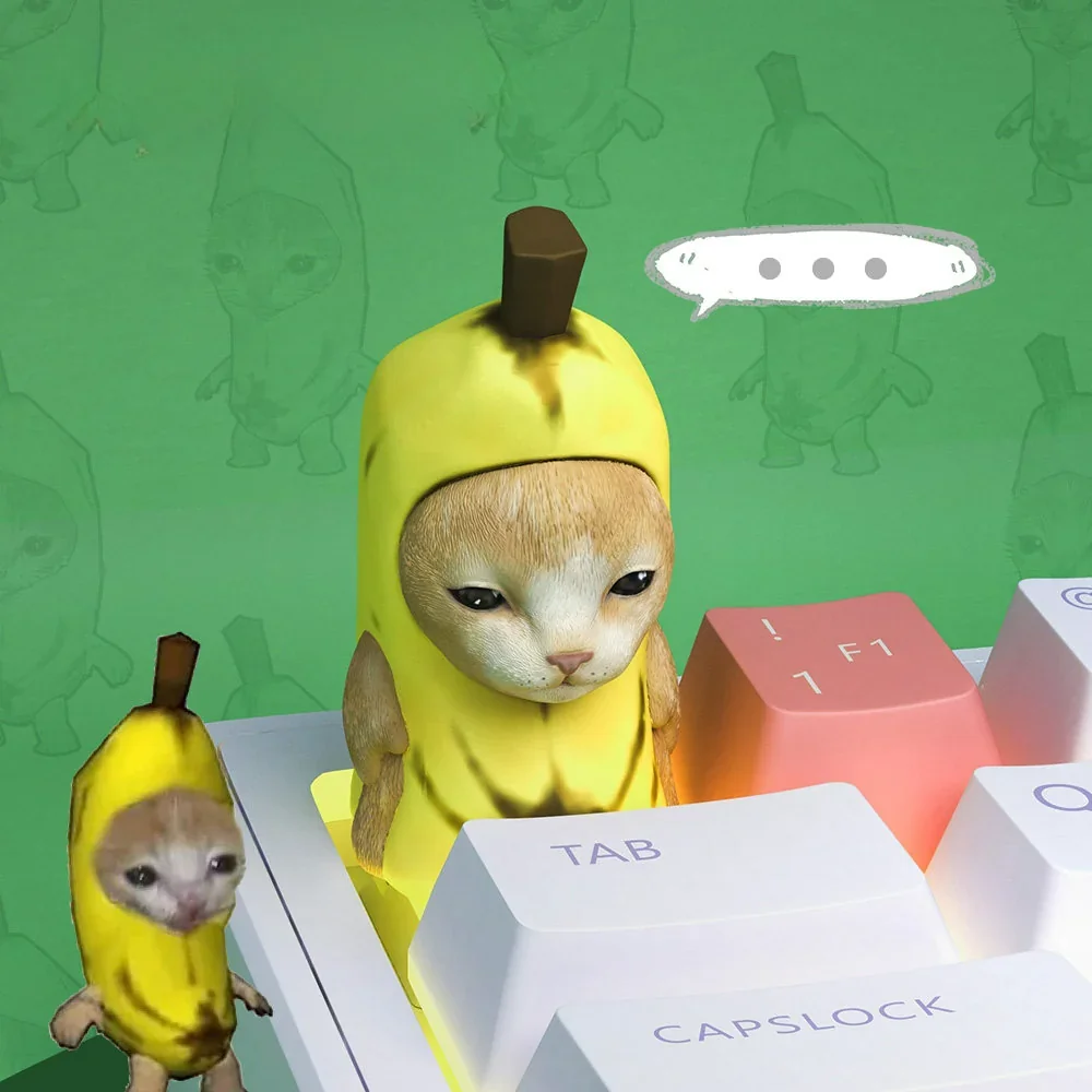 Lifestyle shot of the unique Banana Cat Keycap adding charm to a desk with other accessories.