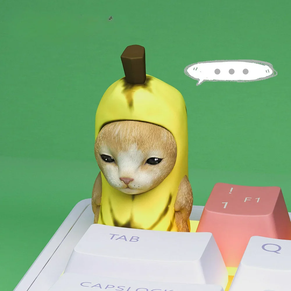 Joyful Banana Cat Artisan Keycap installed on the ESC key position of a custom keyboard setup.