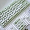Assortment of Butterfly PBT keycap options: purple, red, pink, green, blue.