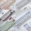 Broken Window Butterfly PBT Keycap Set on mechanical keyboard, side-lit legends glowing purple.