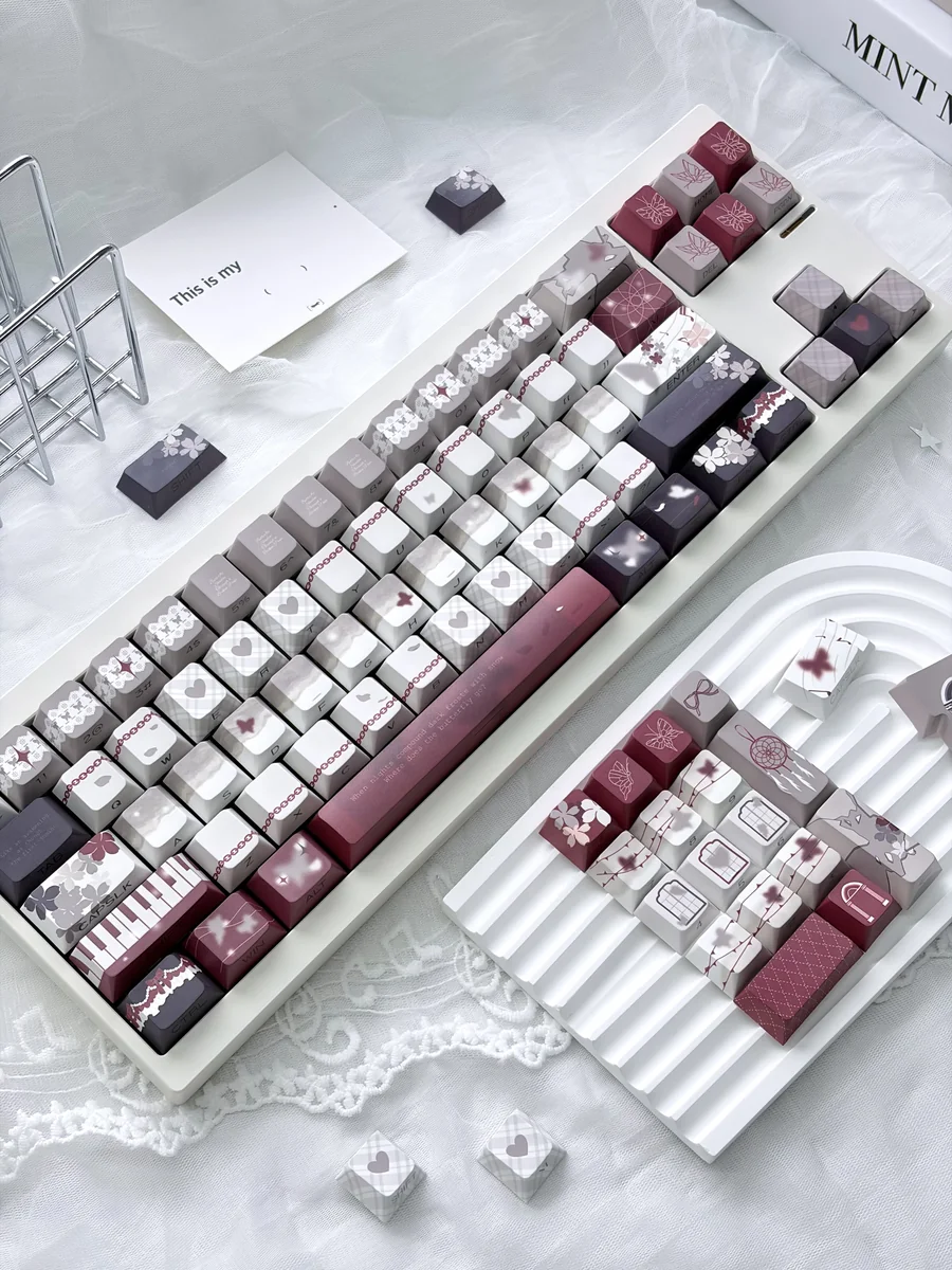 Side view of Cherry profile Butterfly PBT keycaps, highlighting ergonomic sculpting.