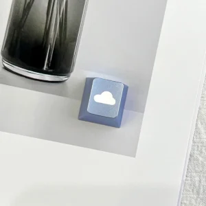 Close-up of CNC machined aluminum cloud texture on keycap