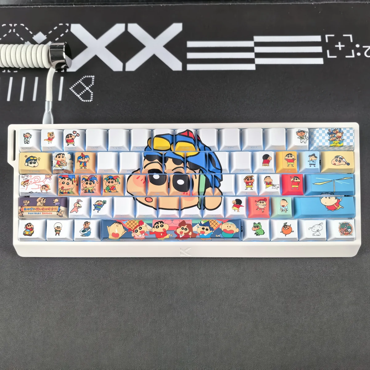 Full layout of Crayon Shin-chan 74-keycap set on a compact mechanical keyboard with RGB backlighting