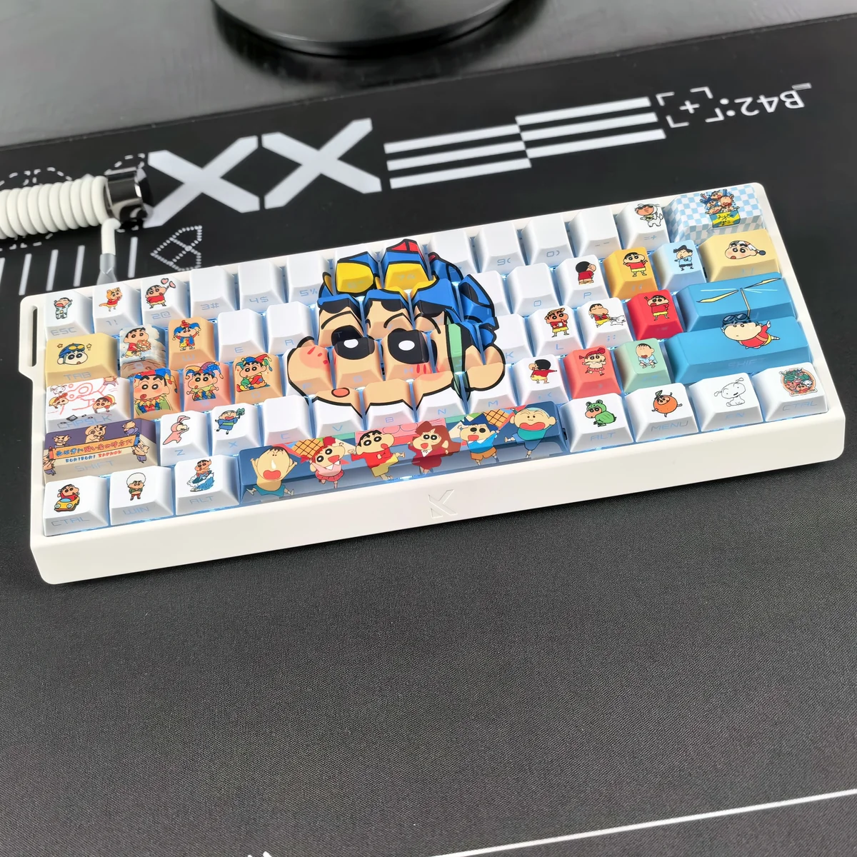 Close-up of a Crayon Shin-chan keycap showing side-printed legend and PBT texture