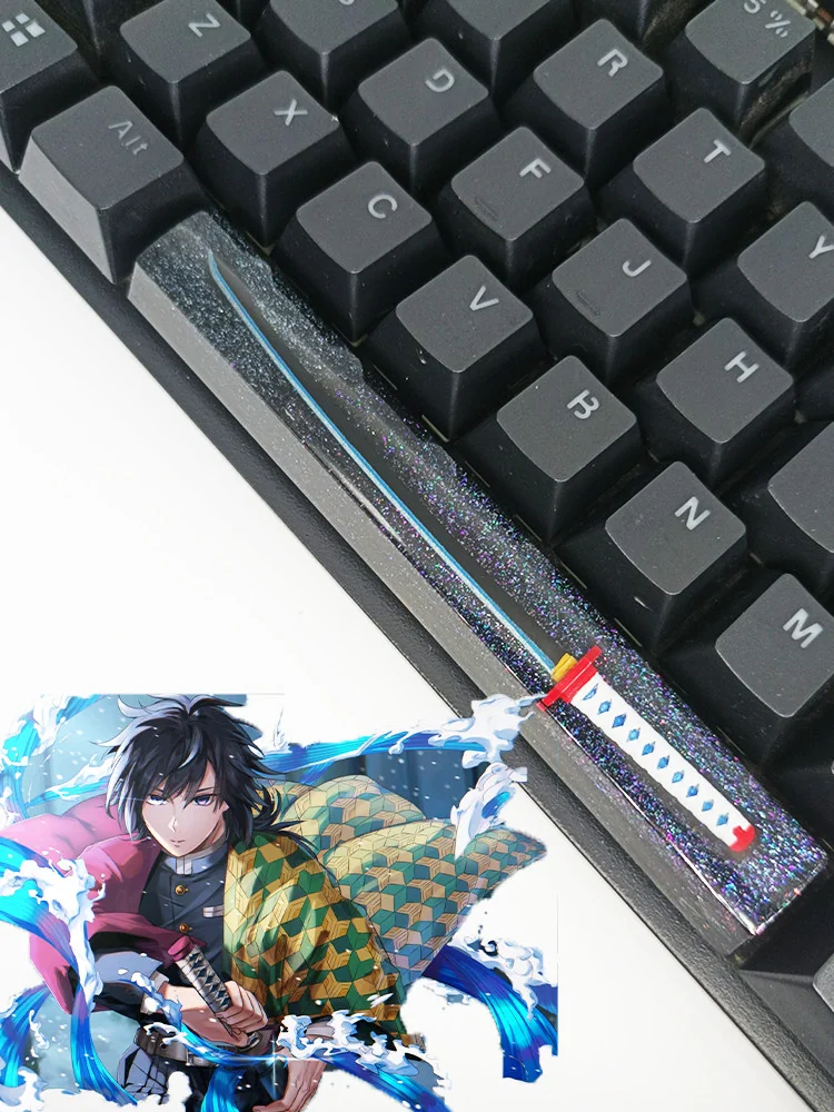 Demon Slayer keycap from the front, highlighting the embedded character and luminous effect