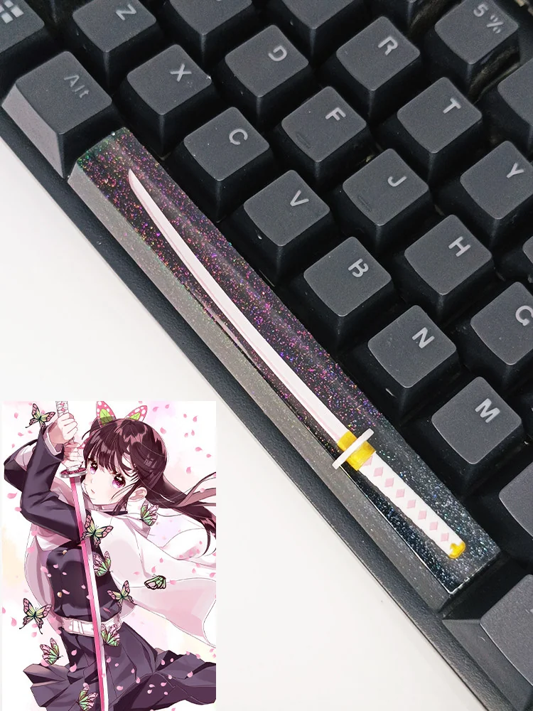 Overhead view of Demon Slayer keycap showcasing translucent starry resin and character detail